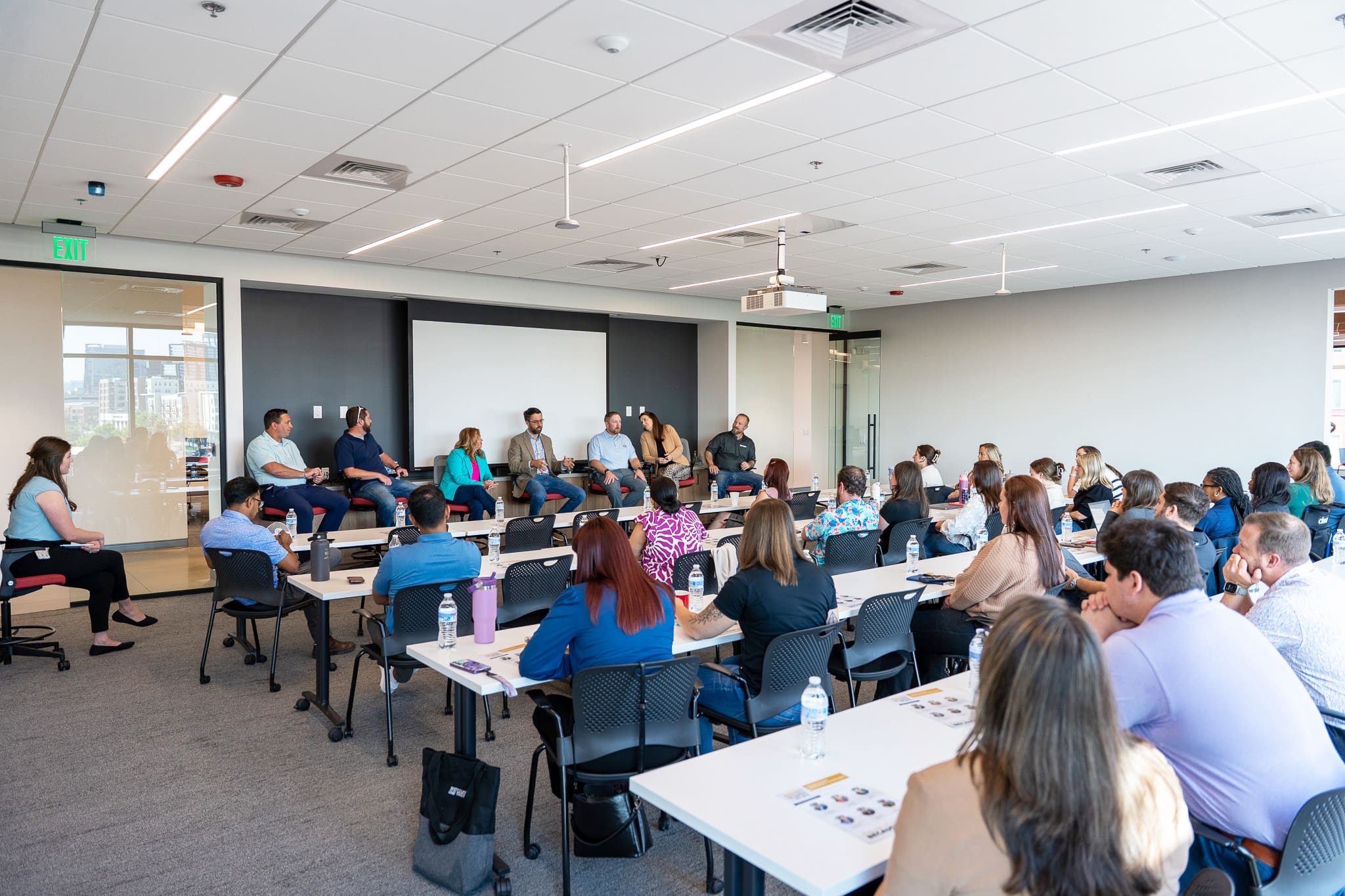 Construction industry leaders engaged in discussion during Samet's 2025 Women at Work panel event, sharing career experiences and mentorship insights