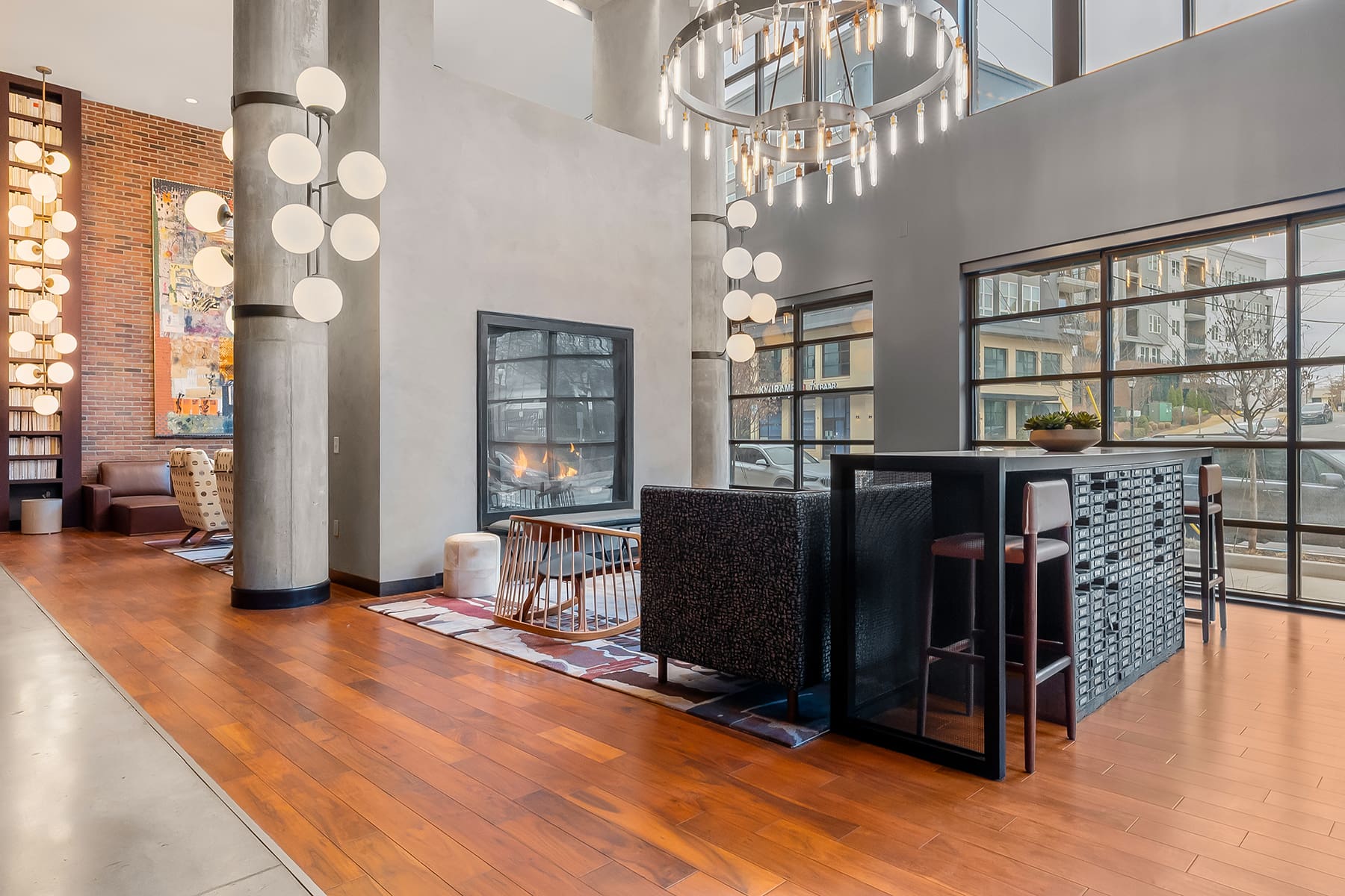 Double-height lobby interior at Hawkins Press apartments in Charlotte