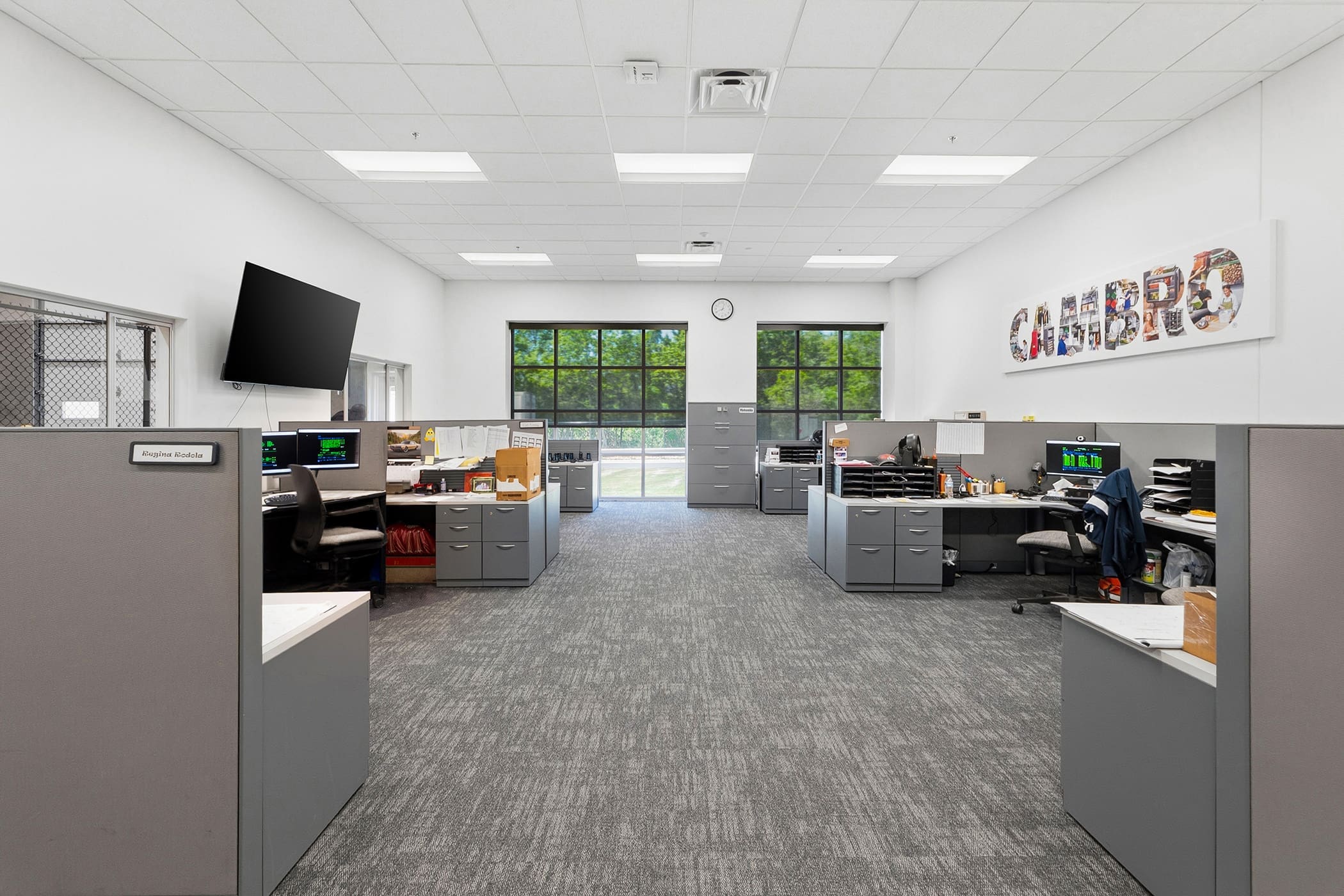 Modern commercial office reception area with branded signage