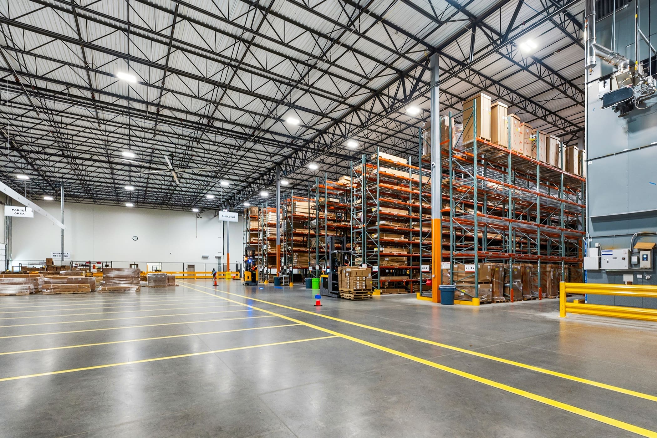 Industrial storage warehouse with high-bay racking systems