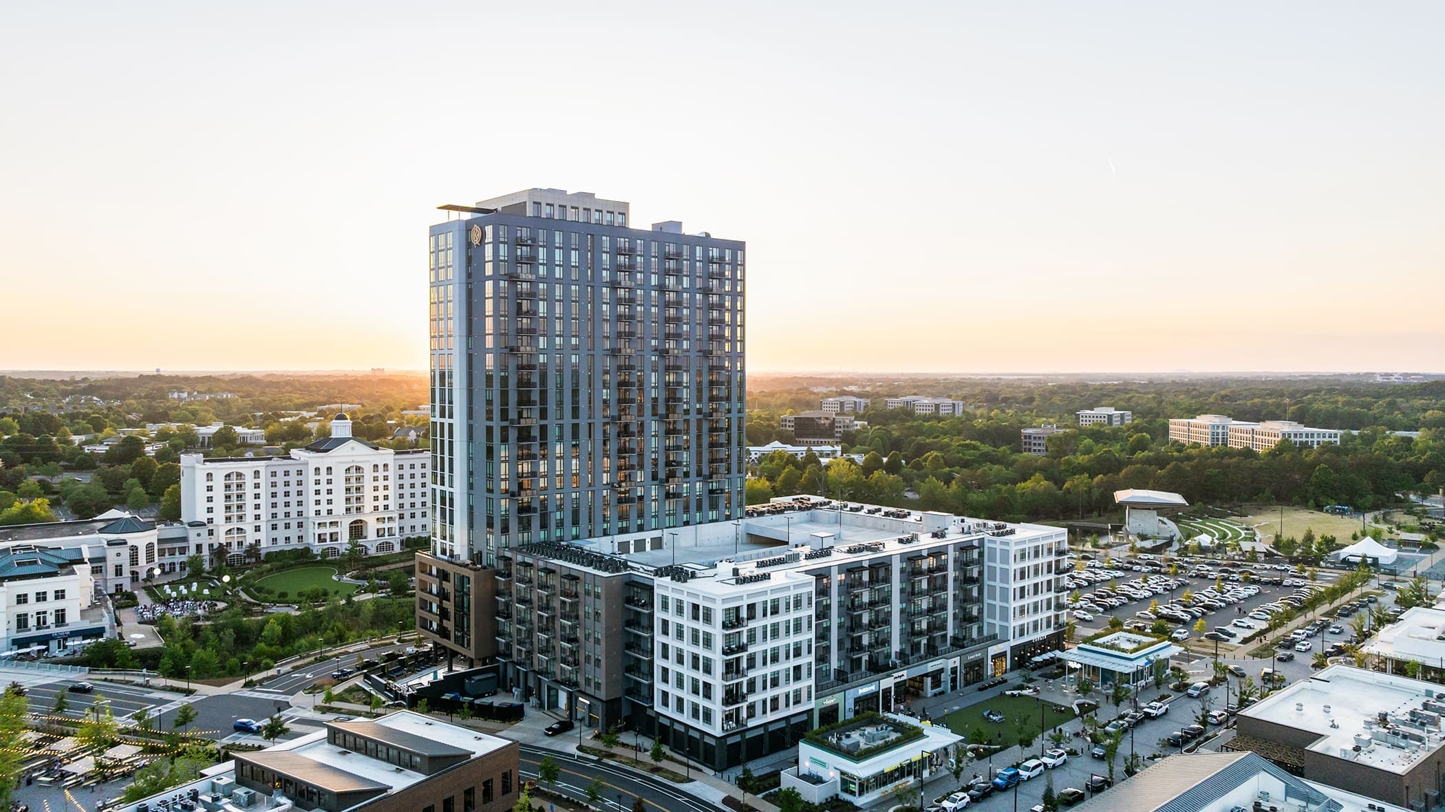 Aerial view of modern mixed-use high-rise apartment community