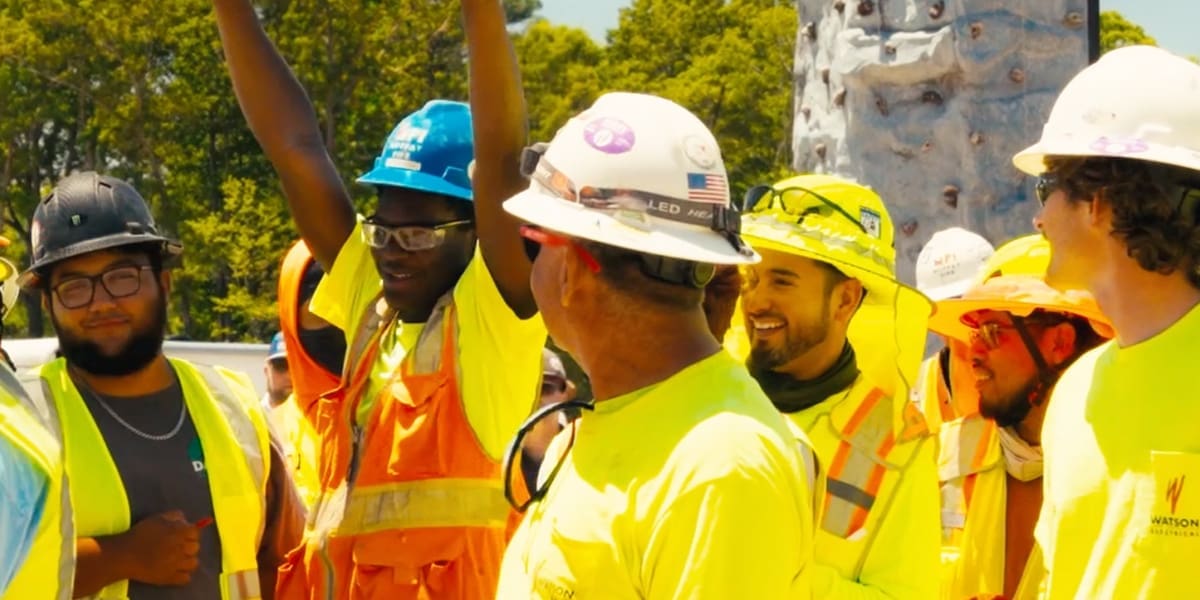 safetywek26 Construction workers in safety gear at active job site